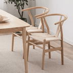 Nordic chair with a clean solid wood frame and a woven wicker look seat