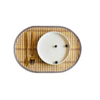 Oval hand woven natural bamboo placemat with even ribs in a Nordic style