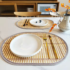 Oval hand woven natural bamboo placemat with even ribs in a Nordic style