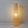 Nordic standing lamp with a hand woven bamboo shade on a slim wood base