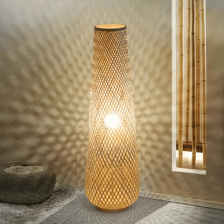 Nordic standing lamp with a hand woven bamboo shade on a slim wood base