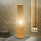 Nordic standing lamp with a hand woven bamboo shade on a slim wood base