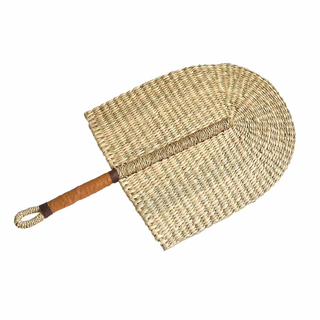 Arched woven paddle hand fan with an orange wrapped handle and loop