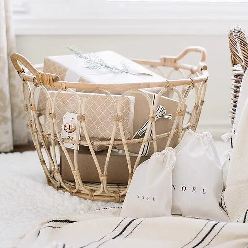 Open frame rattan basket holding folded blankets