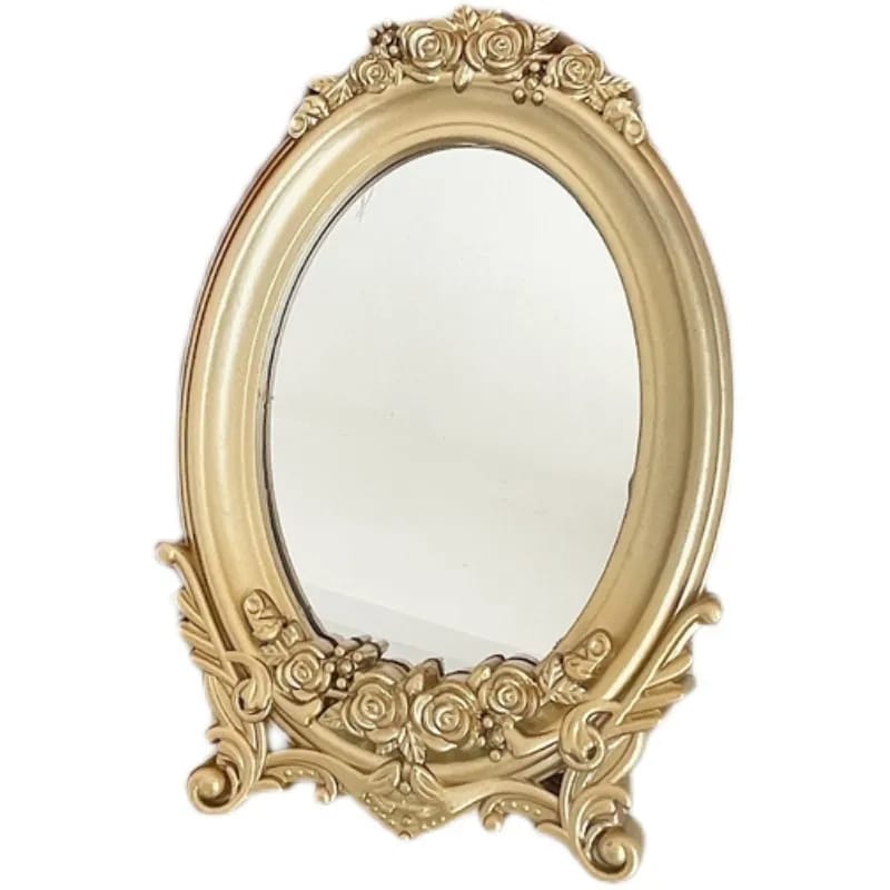 Small oval mirror with ornate gold rose frame