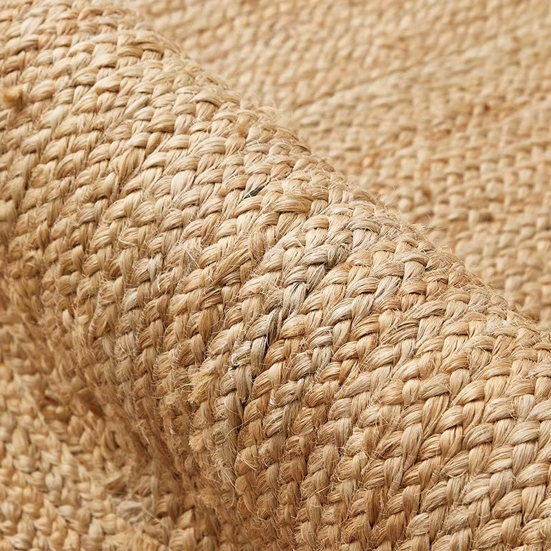 Oval jute rug with a thick cream border