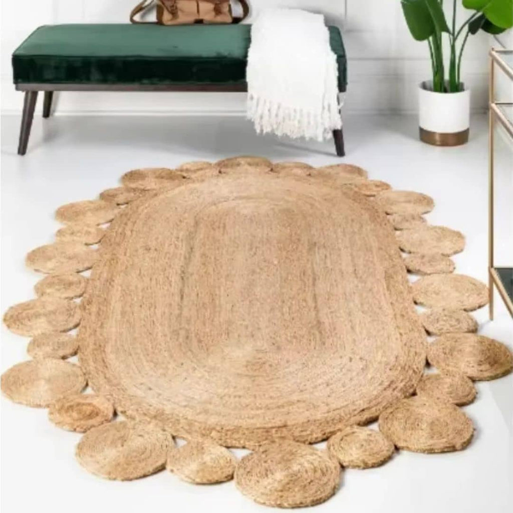 Oval jute rug edged with braided circles
