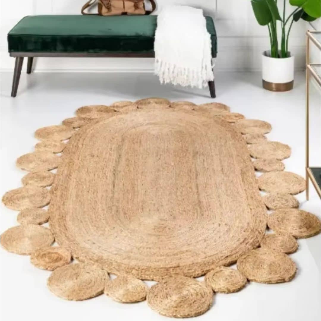 Oval jute rug edged with braided circles