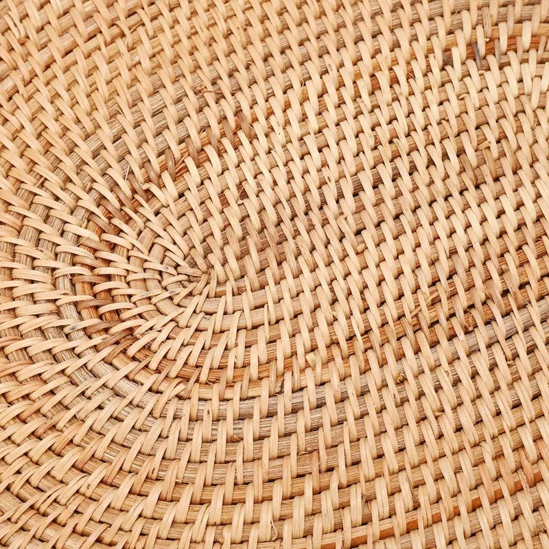 Oval hand woven honey toned natural rattan placemat