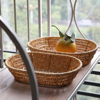 Oval rattan look bread basket with an orange