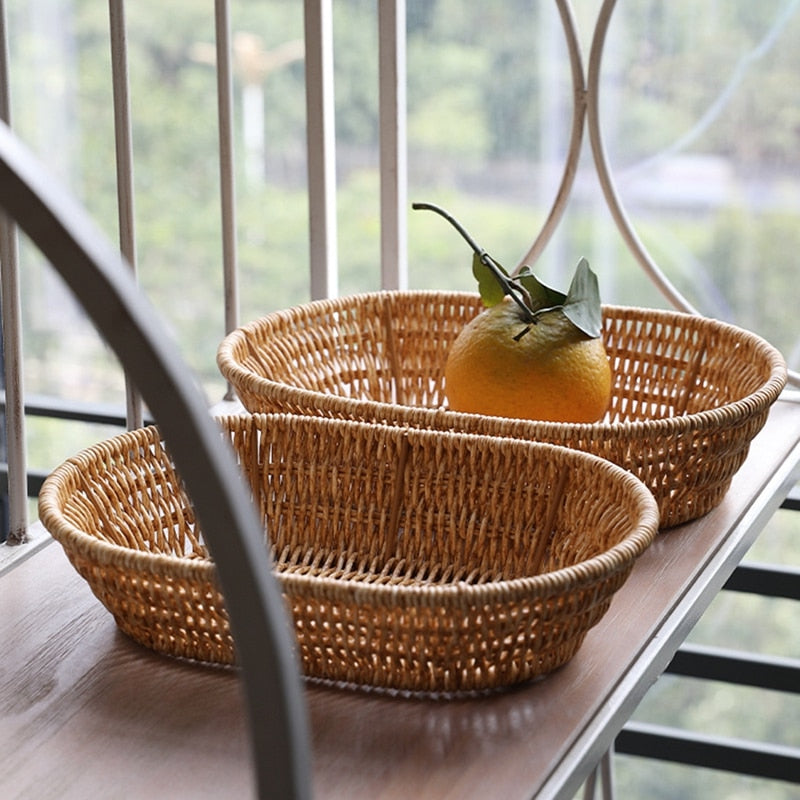 Oval rattan look bread basket with an orange
