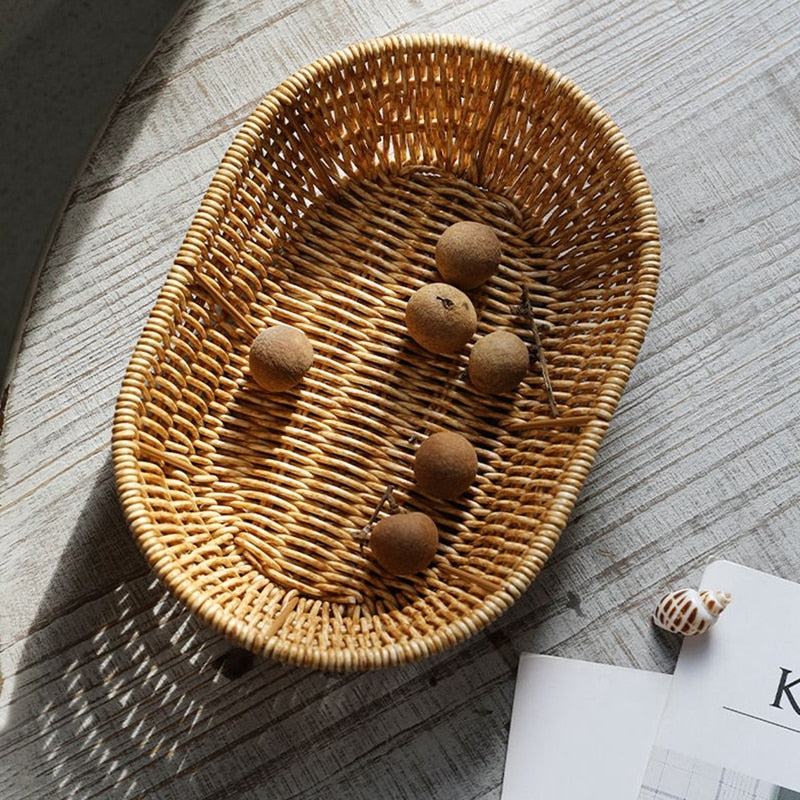 Oval rattan look bread basket with an orange