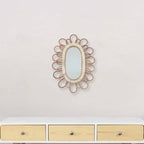 Oval mirror with a rattan frame of petal loops