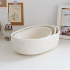 Low oval white cotton rope basket