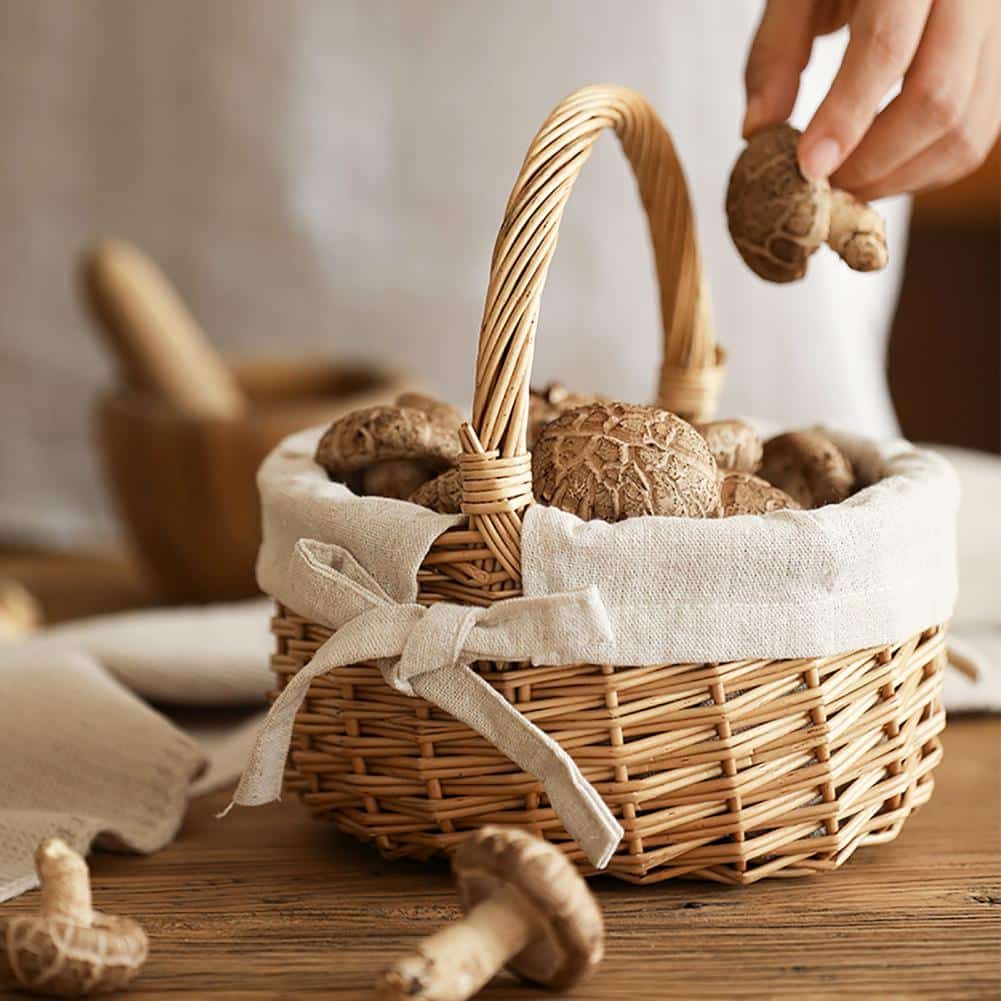 Oval wicker basket with beige linen liner tied with a bow