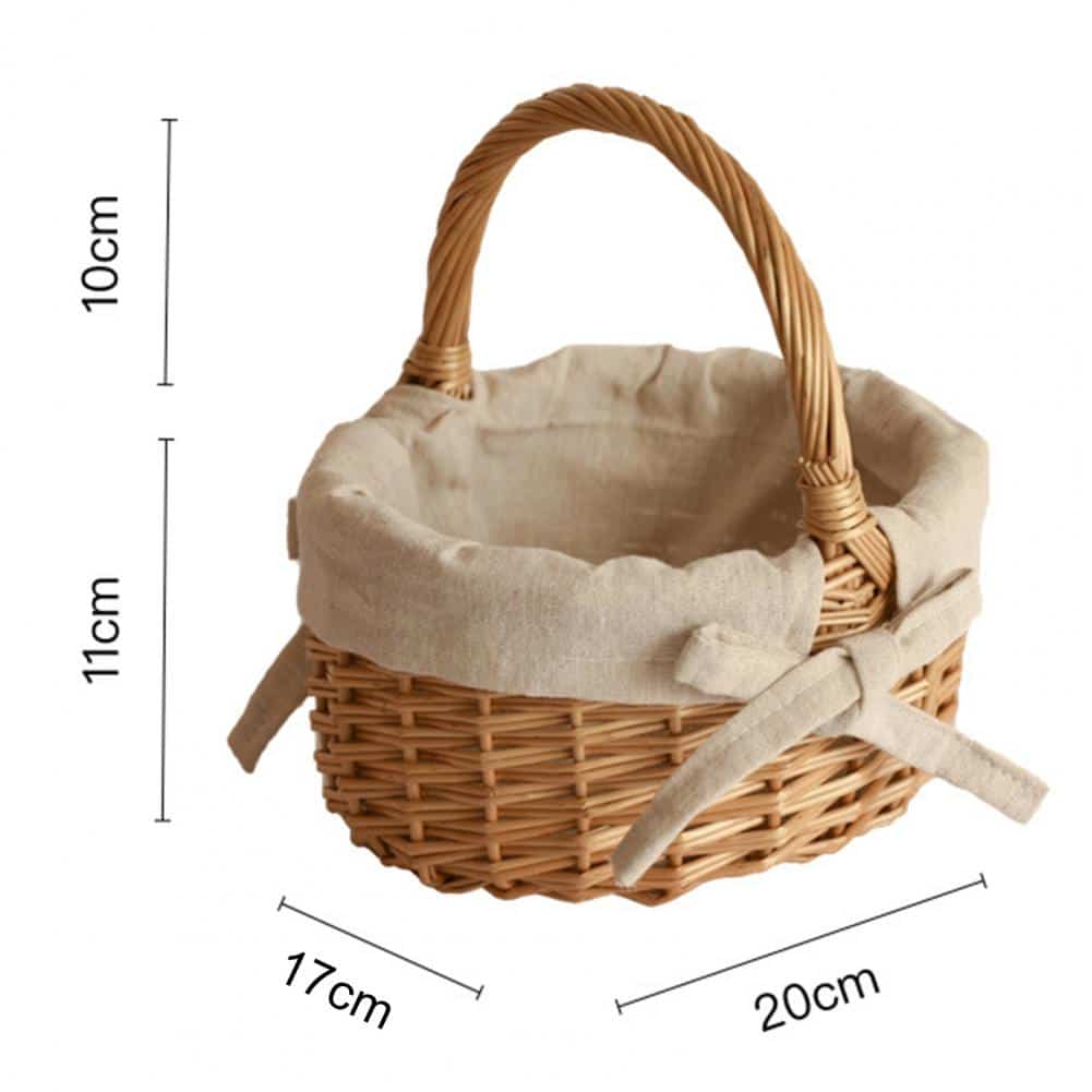 Oval wicker basket with beige linen liner tied with a bow