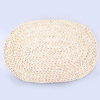 Oval placemat hand woven in golden dried corn husk