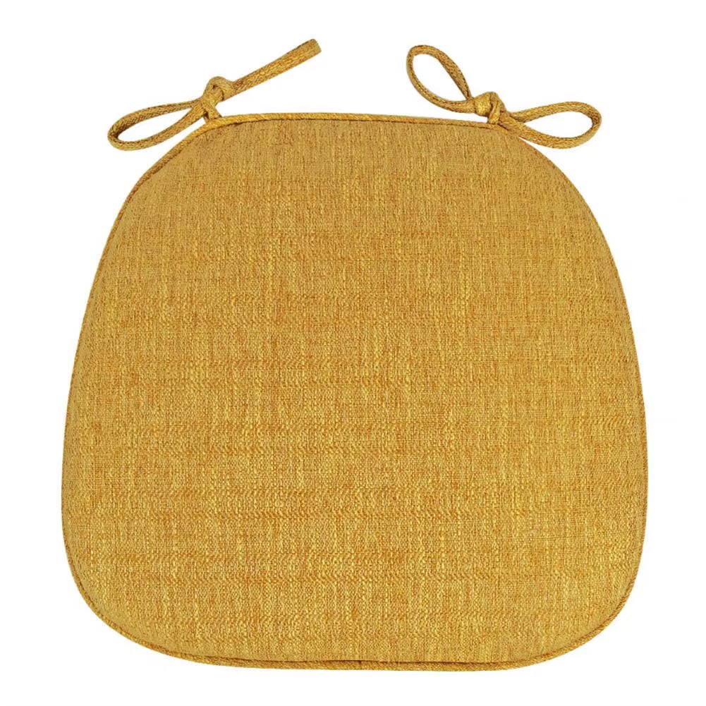 Yellow padded polyester seat cushion with ties for a rattan chair