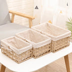 Paper rope storage baskets with fabric liners on open shelves