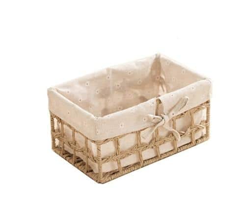 Paper rope storage baskets with fabric liners on open shelves