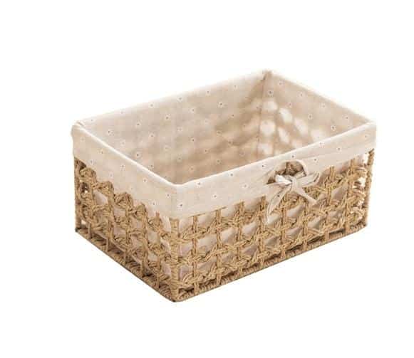 Paper rope storage baskets with fabric liners on open shelves