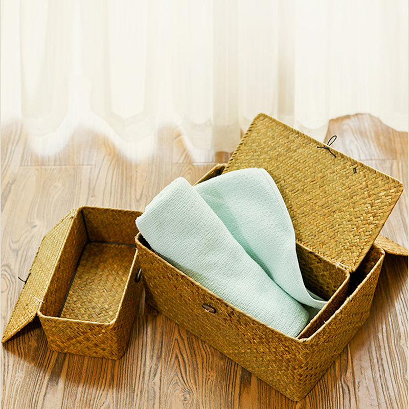 Hand woven patinated rattan trunk box with a lid, offered in three sizes