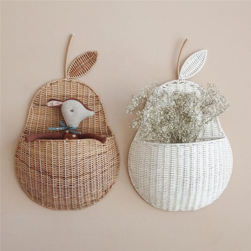 Pear shaped rattan wall baskets in brown and white with plush toys