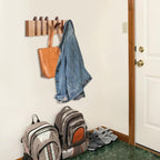 Wood wall coat rack with fold down hooks like piano keys