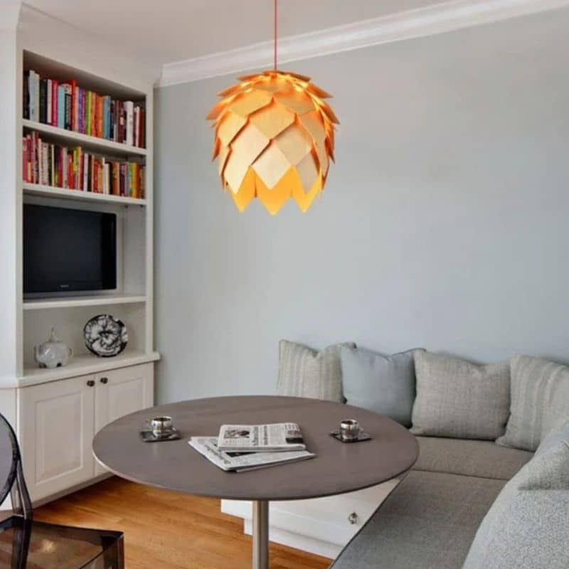 Pine cone shaped pendant light made of layered natural wood scales