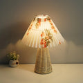 Round pleated white rattan lamp with woven floral motifs