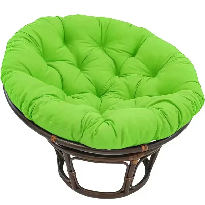 Thick pouf style cushion in a bright color for a rattan papasan chair