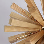 Round chandelier with oak slats assembled in a radiating pattern