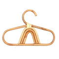 Kids' clothes hanger hand woven in natural rattan in a rainbow shape