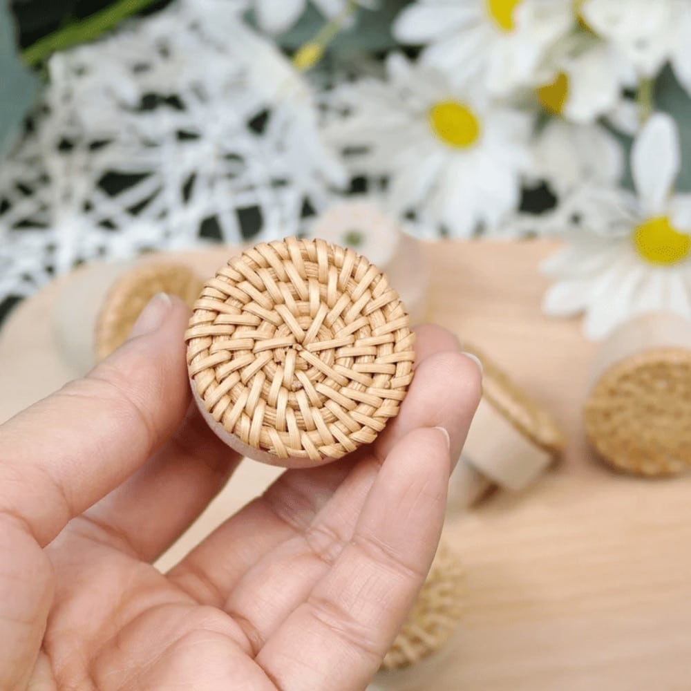 Round furniture knob in woven rattan with a beech wood base