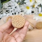 Round furniture knob in woven rattan with a beech wood base