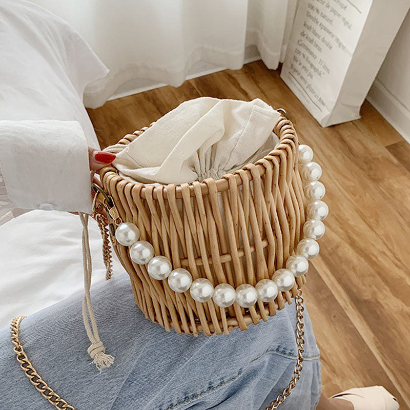 Small round rattan bucket bag with pearl handle