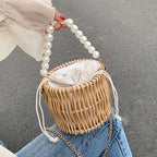 Small round rattan bucket bag with pearl handle