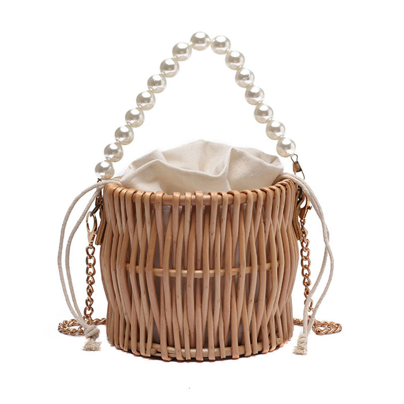 Small round rattan bucket bag with pearl handle