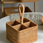 Square rattan caddy with four compartments and a tall handle