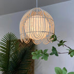 Rattan dome pendant with looped fringe and white inner shade