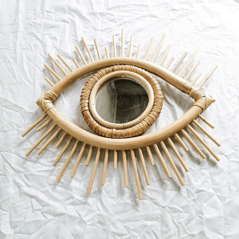 Eye shaped rattan mirrors with sunburst rays
