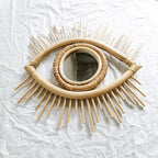 Eye shaped rattan mirrors with sunburst rays