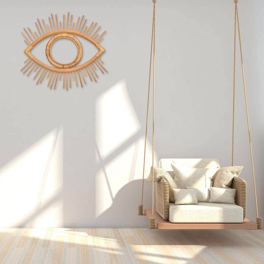 Open rattan eye shaped wall frame with rays