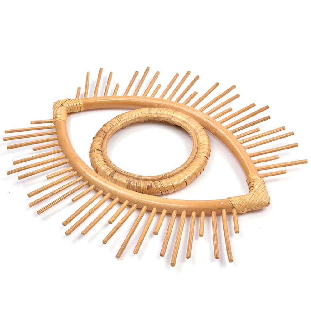 Open rattan eye shaped wall frame with rays