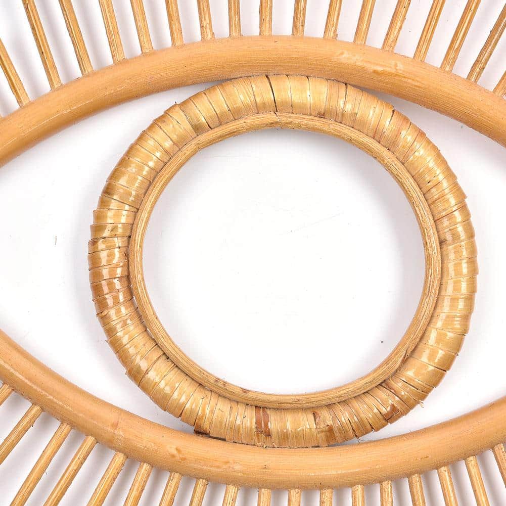 Open rattan eye shaped wall frame with rays