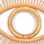 Open rattan eye shaped wall frame with rays