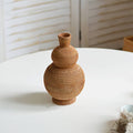Handwoven rattan vase in a stacked gourd shape