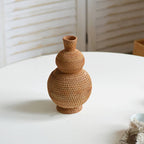 Handwoven rattan vase in a stacked gourd shape