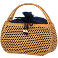 Honey toned hand woven rattan handbag with varnished wooden handles and a drawstring
