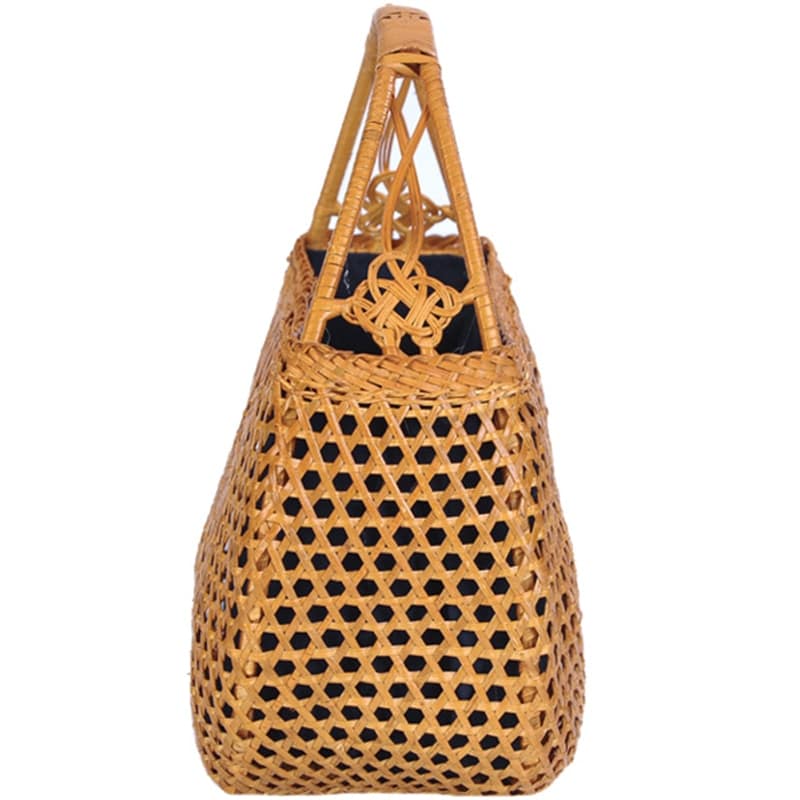 Honey toned hand woven rattan handbag with varnished wooden handles and a drawstring